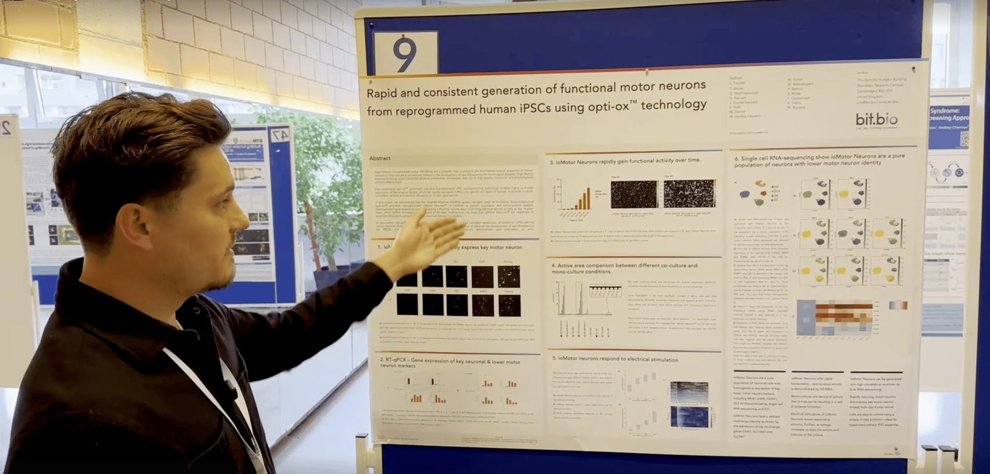 Luke pointing at ioMotor Neurons poster at MaxWell Summit 2024
