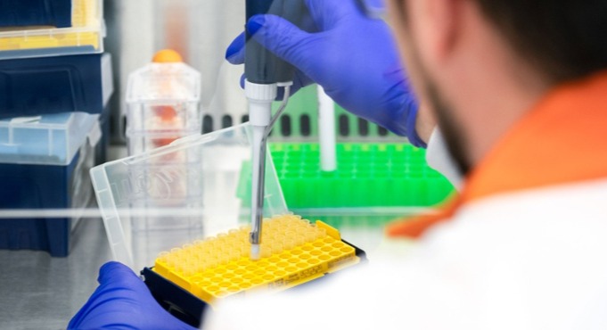 An image of a scientist preparing to work with iPSC-derived cells